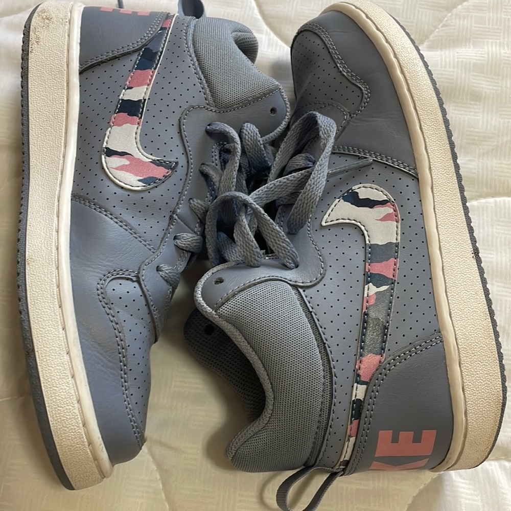 Nike high tops with camo swoosh